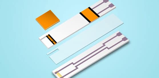 Exploded view of a test strip with colored and metallic components on a blue background.